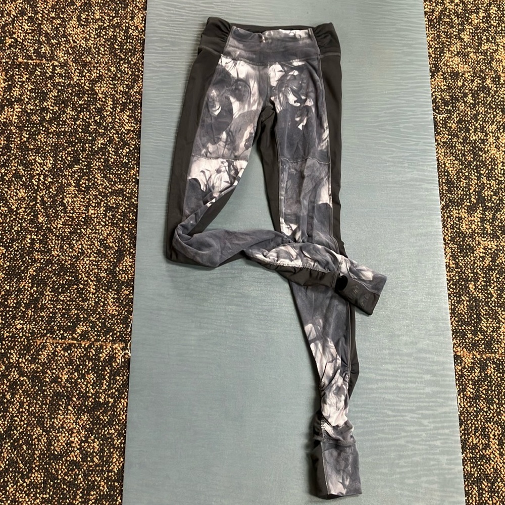 Lucy grip stirrup yoga pants, black with “smoke” patterned front, XS